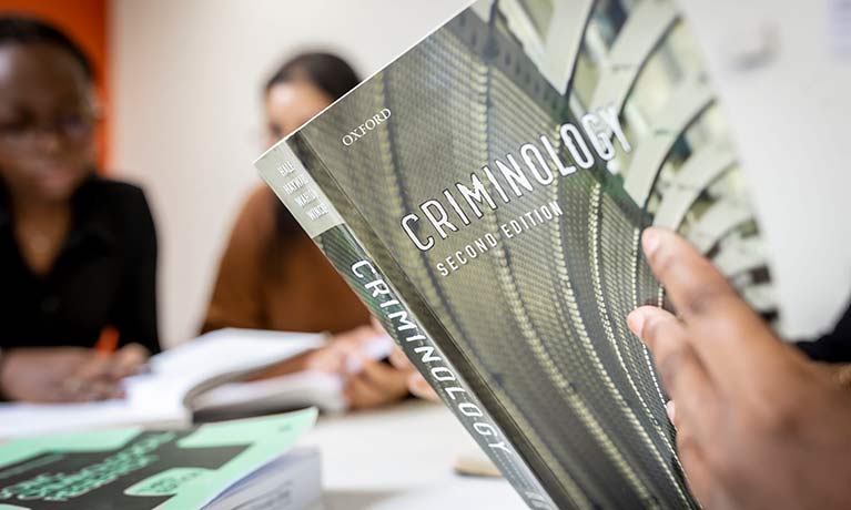 Students reading textbooks