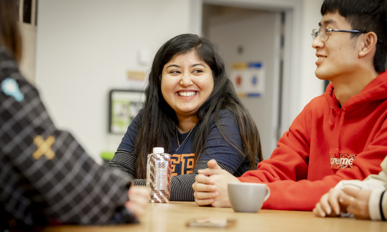 Students talking in the hub