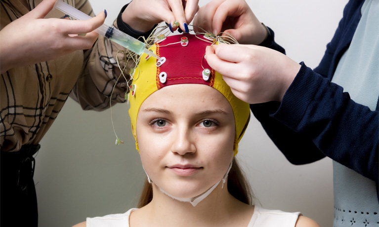 Students using an electroencephalogram (EEG)