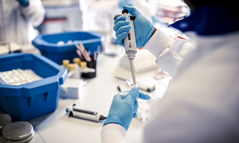 Close up of a student conducting an experiement in the SuperLab