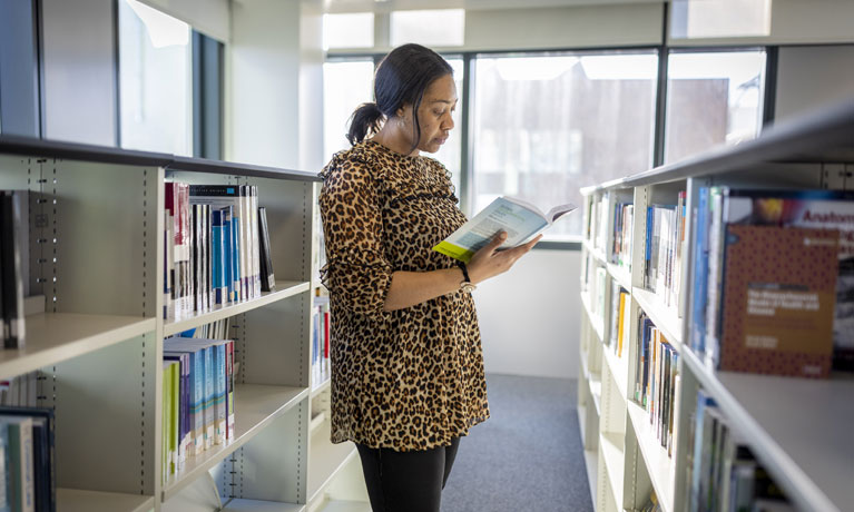 A student reading in the library