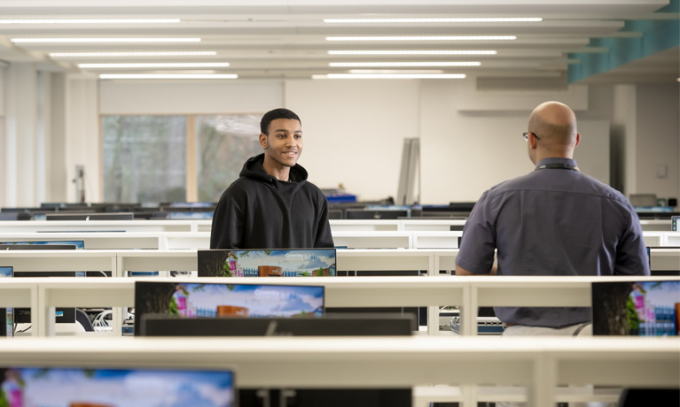 Student with tutor in the IT suite