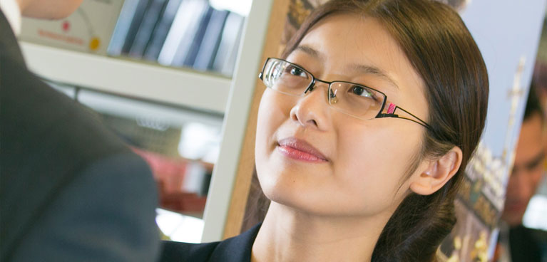 Coventry University London An international student in a library.