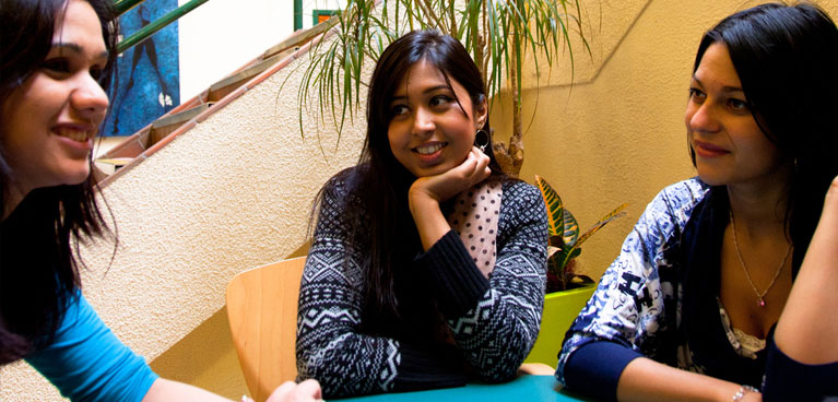 Postgraduate Scholarships Students chatting in an informal setting.