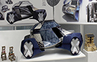 Futuristic design of a model car sat on a shelf