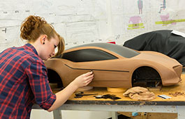 A student working on creating a model of a vehicle