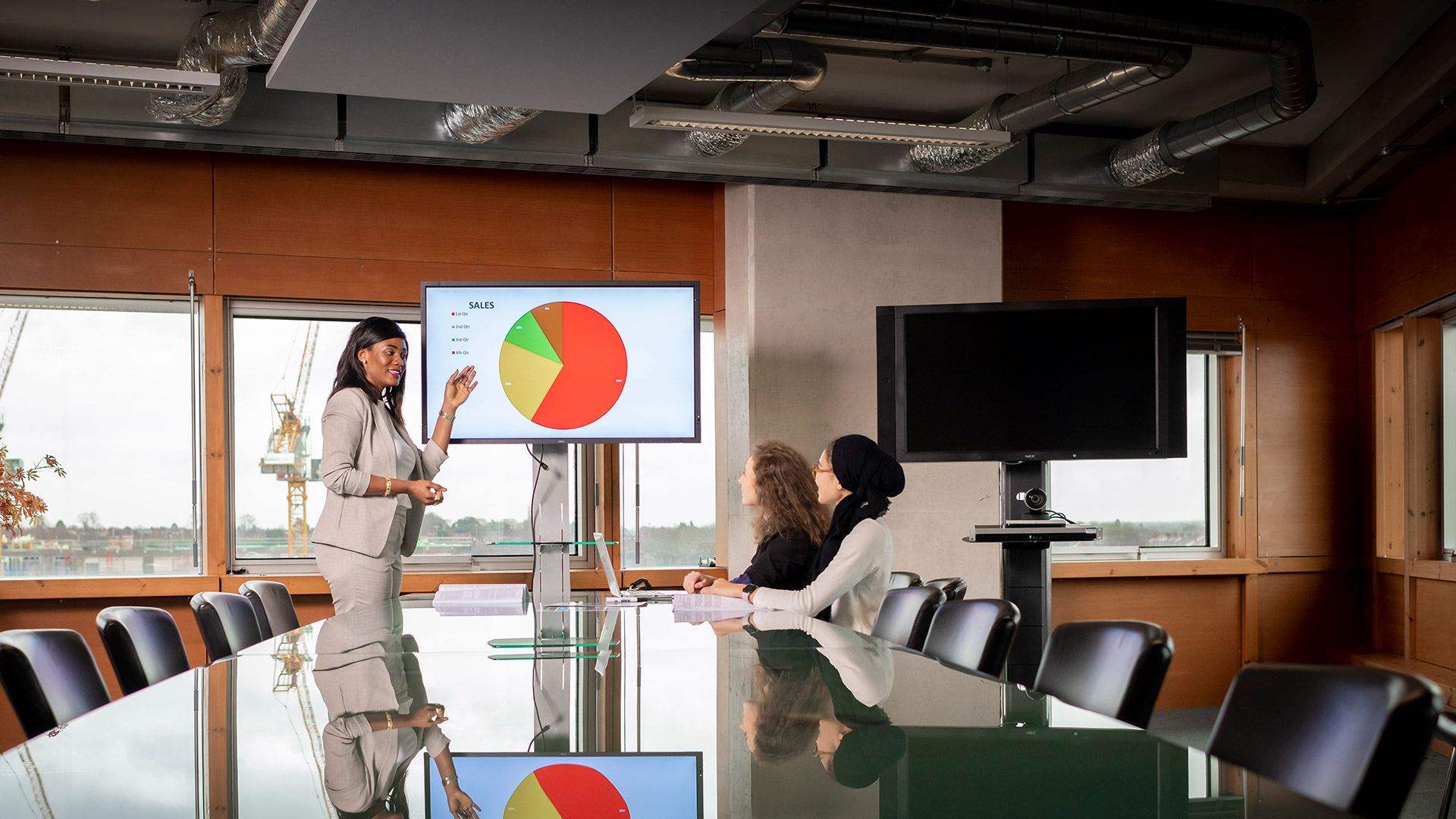 Student presenting a sales powerpoint to a group