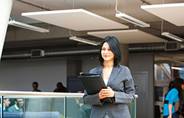 woman in business suit holding a folder