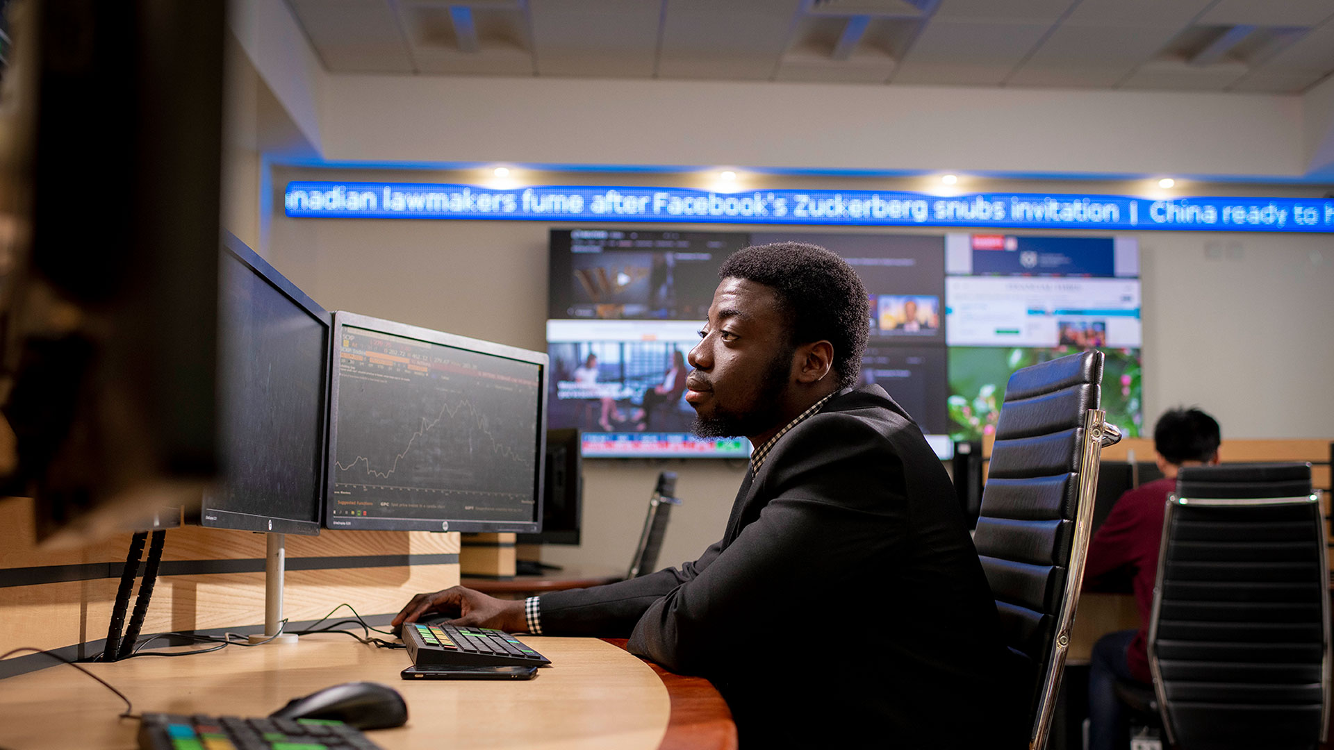 Student using dual computer monitors