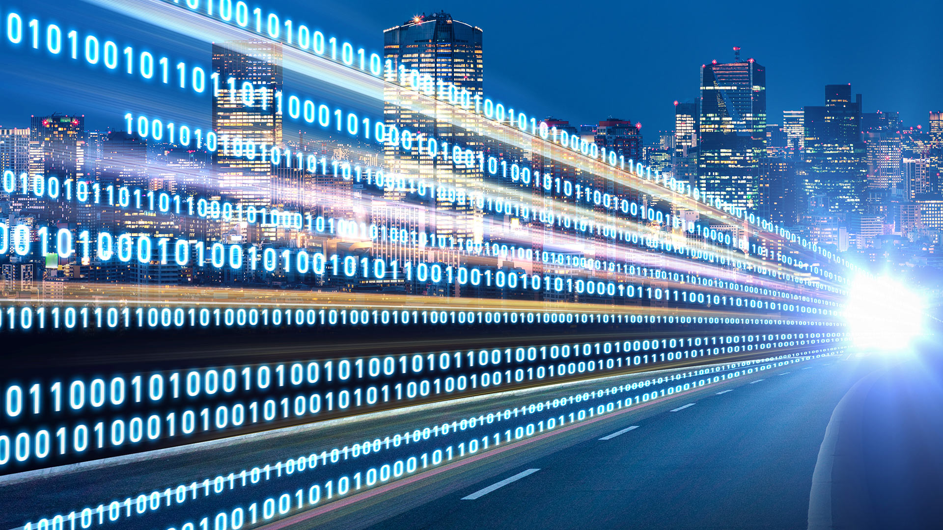 Graphic image of city skyline at night with an array of the numbers 1 and 0 in lines
