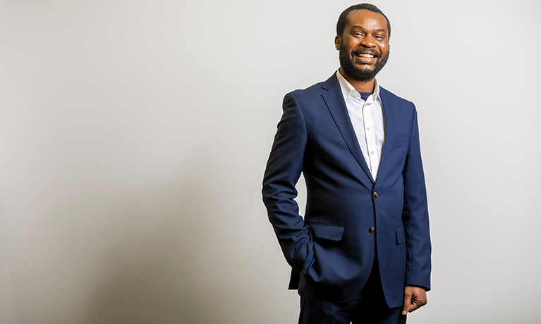 Ayotunde Oyelakin Course Director wearing a suit with a white background