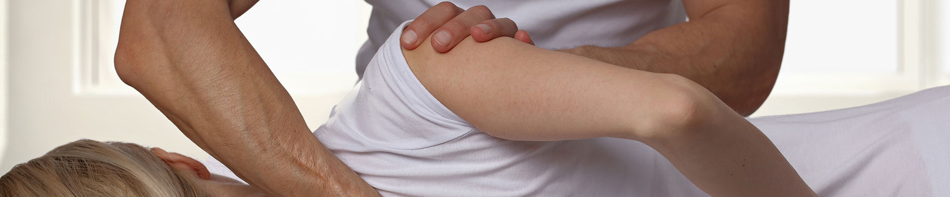 A Chiropractor working on a clients back