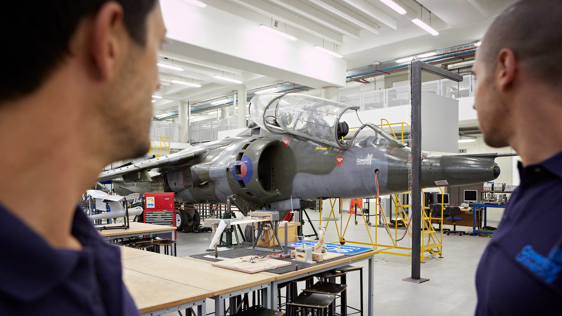 students next to the harrier jet at Coventry University