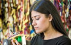 Female student working on a model car with lots of wires