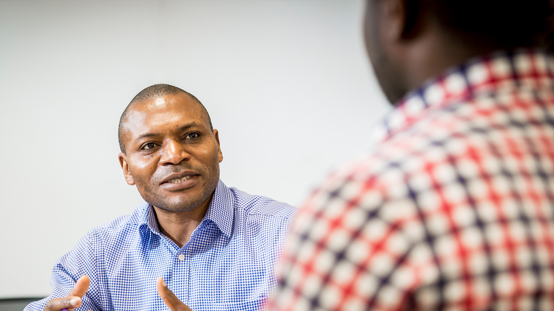 close up of a two males in conversation