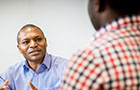 close up of a two males in conversation