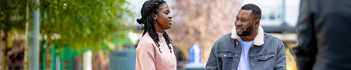 two students chatting on campus