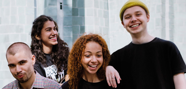 Group of students smiling looking at the camera