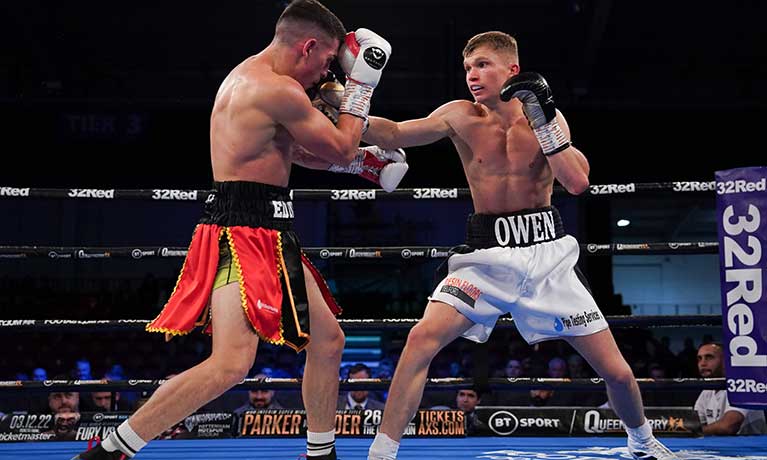 Boxer Macauley Owen fighting in a box ring 