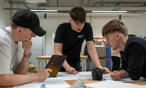 Three students working together on a product design project