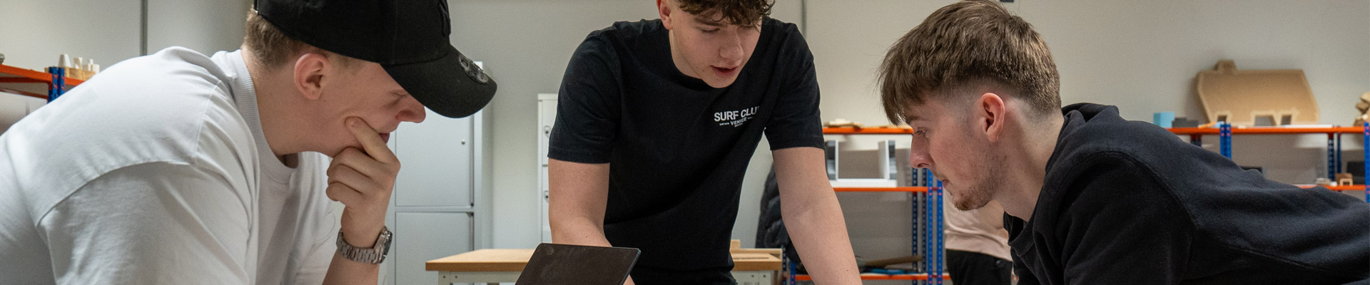 Three students working together on a product design project