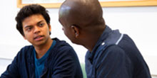 Two staff members talking