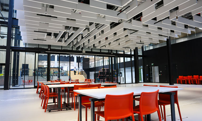 An internal view of chairs and tables set up in the Hyperstudio in the Delia Derbyshire Building