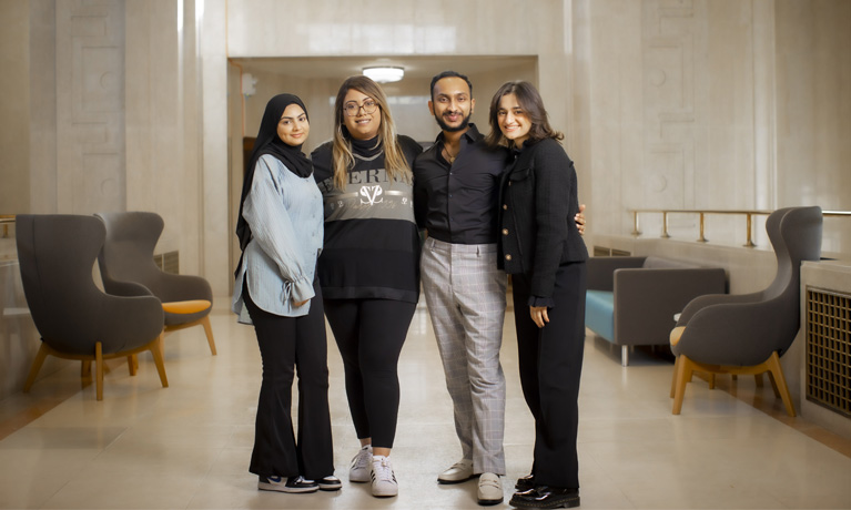 4 students in an CU London reception building 