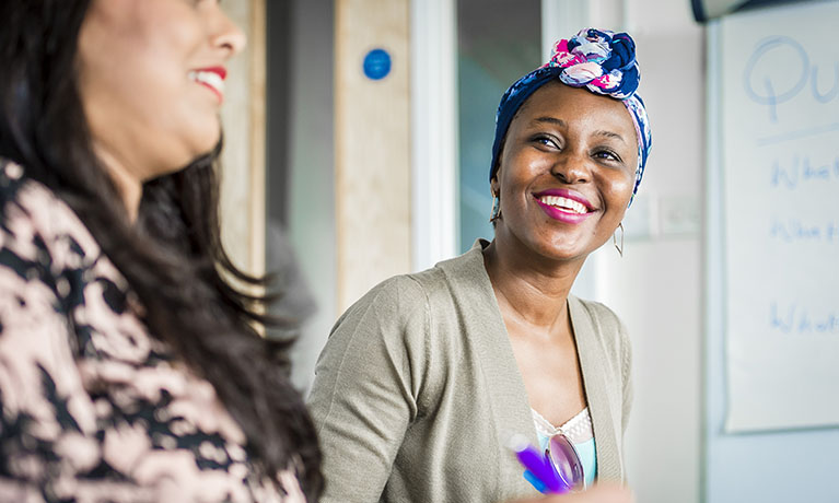 Closeup of two women smiling