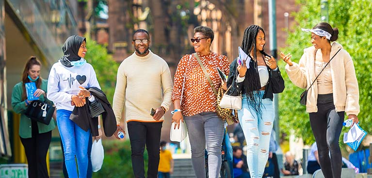 group of students walking through the campus