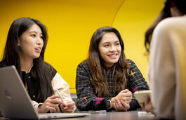 Group of international students in a study booth in The Hub