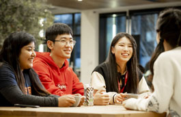 Group of international students chatting in The Hub cafe