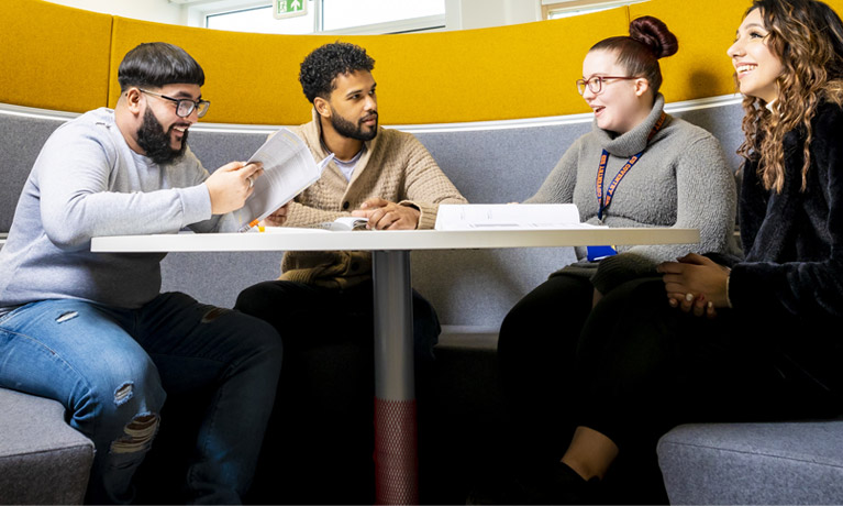 Students chatting in a booth at the CU Coventry campus