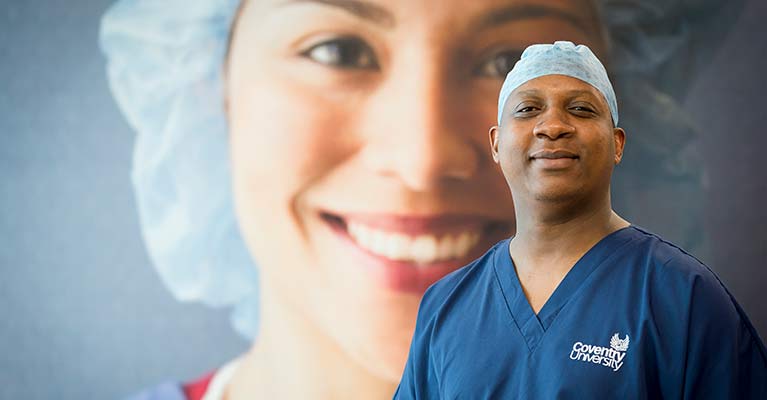 A male nurse in scrubs