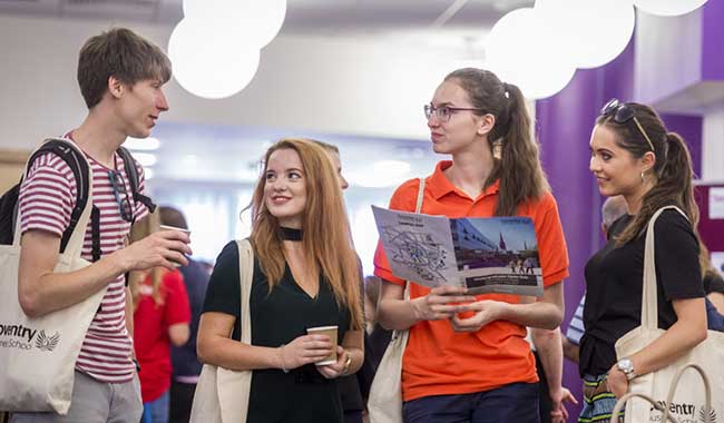 Students conversating in a university building