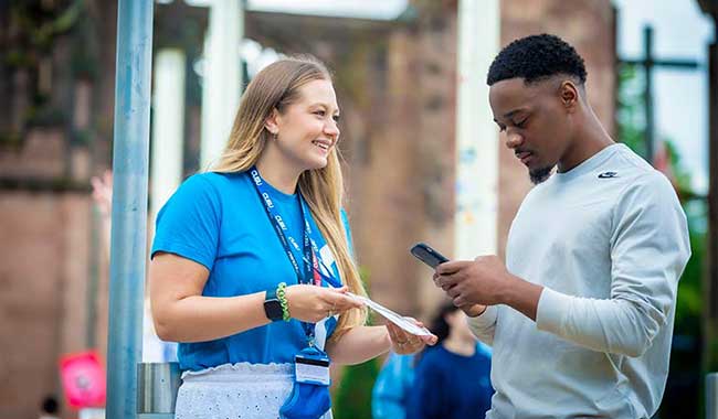 Student support worker chatting to a student
