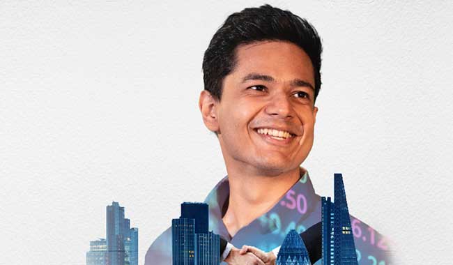 Postgraduate male student standing in a corridor 