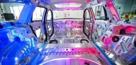 interior view of bare vehicle shell in a workshop