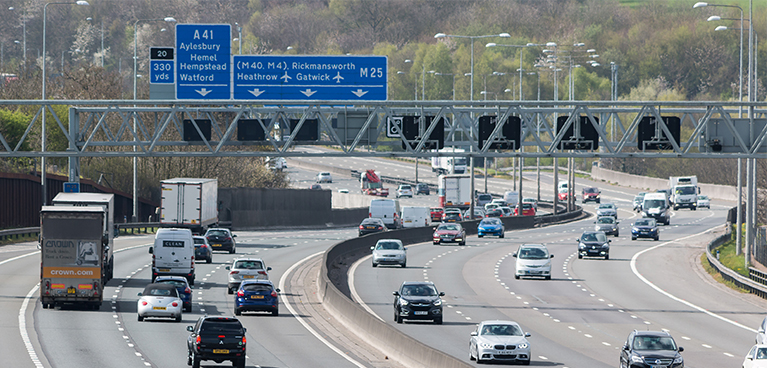View of the motorway with lorries and cars traveling both ways
