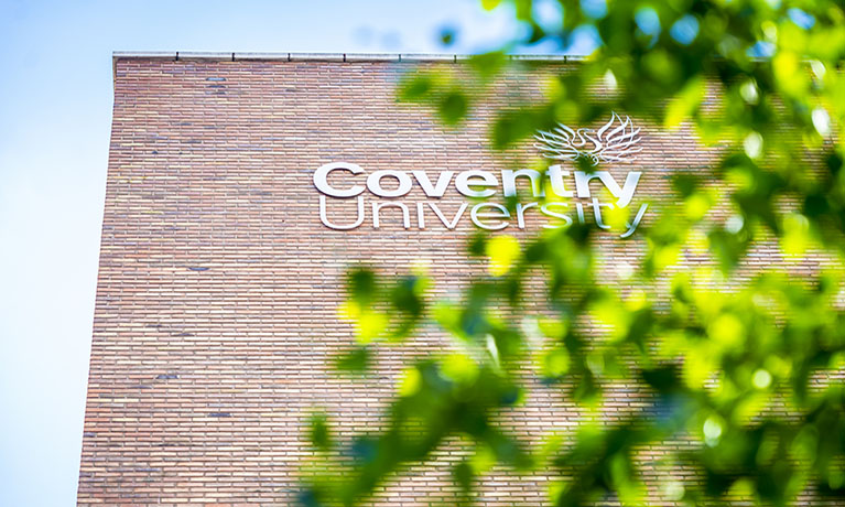 Coventry University Building behind a tree