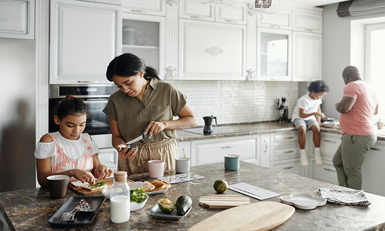 family in the kitchen preparing dinner