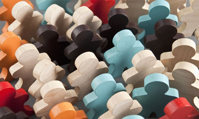 coloured wooden pieces in the shape of people