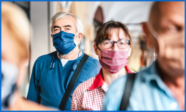 Man and lady wearing surgical masks.