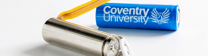 A battery with the Coventry University logo on it and a new type of battery displaying its components
