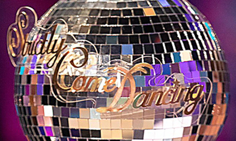 A mirror ball with the words 'Strictly Come Dancing' on it