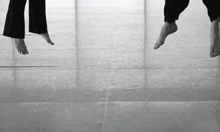 a photo of people's feet while they are jumping