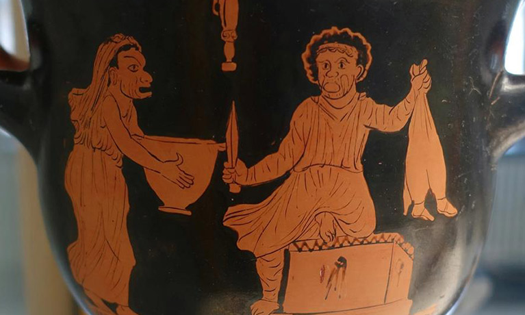 An ancient Greek vase depicting a character holding a bowl and another holding a knife 