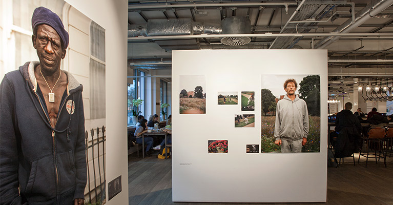 a photography exhibition, featuring photos of men.