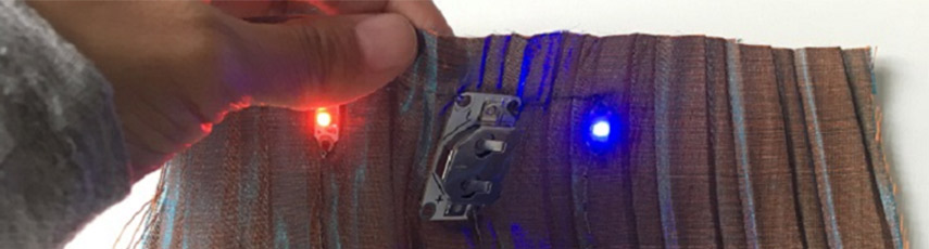 Red and blue light being held up