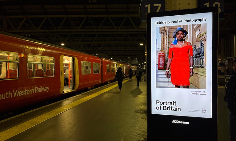 Portrait of Britain exhibition at Waterloo Station featuring Assisted Self-Portrait of Mauvette Reynolds from Construct by Anthony Luvera